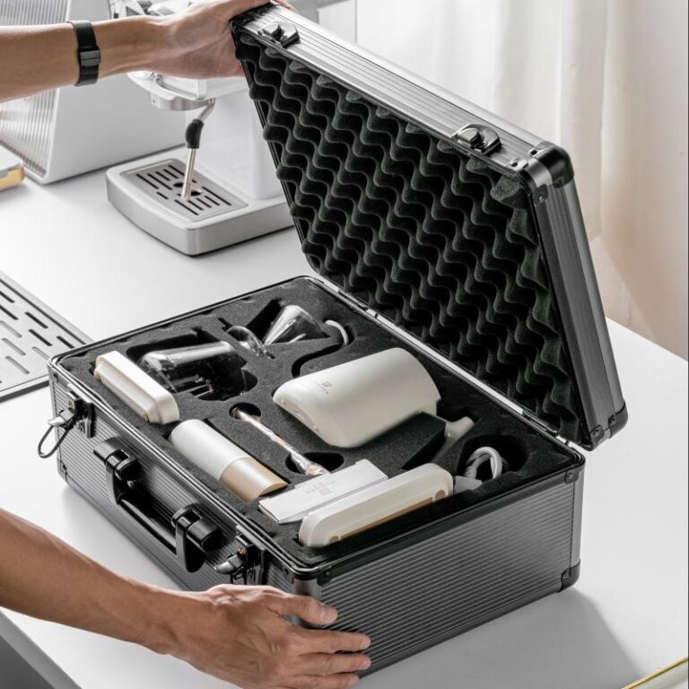 Coffee gift set packed in an aluminium flight case with a die-cut foam insert holding a kettle, brewer, cups and accessories