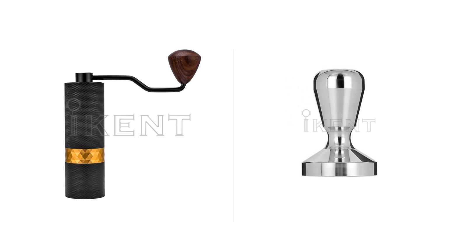 A coated black manual grinder with a coloured band and wooden handle beside a polished stainless steel tamper
