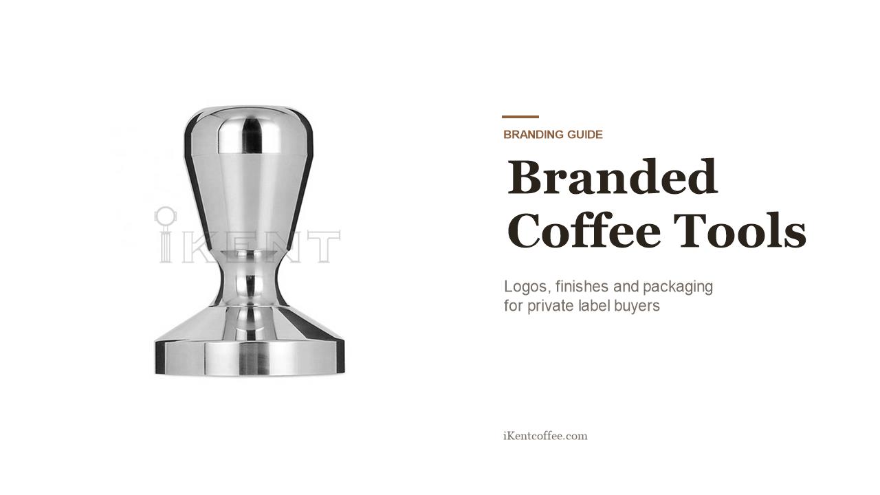 Branded stainless steel coffee tools with laser-marked logos on a light background